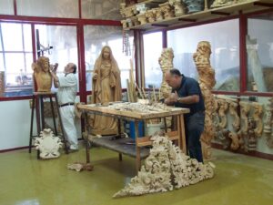 Carving process of religious art pieces.